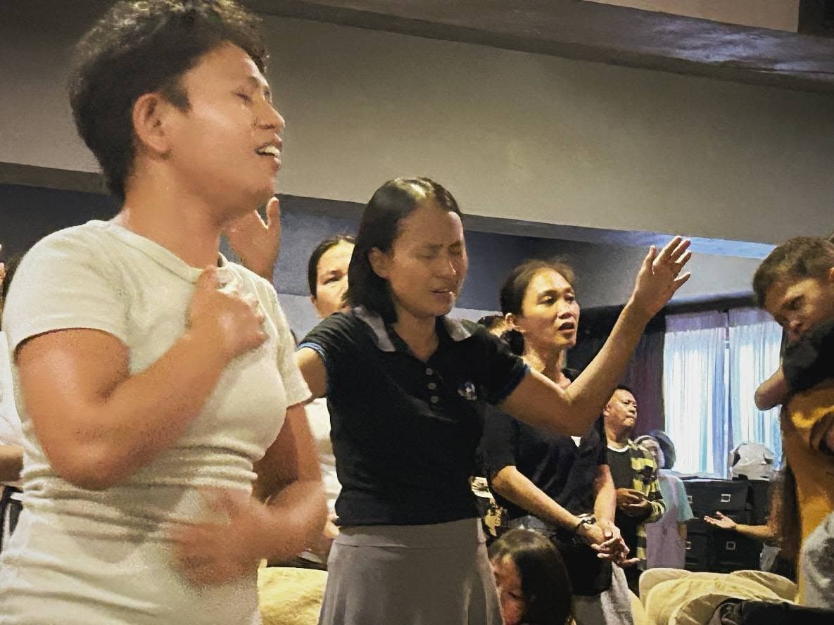 Women of MCOF worshipping during a Sunday service