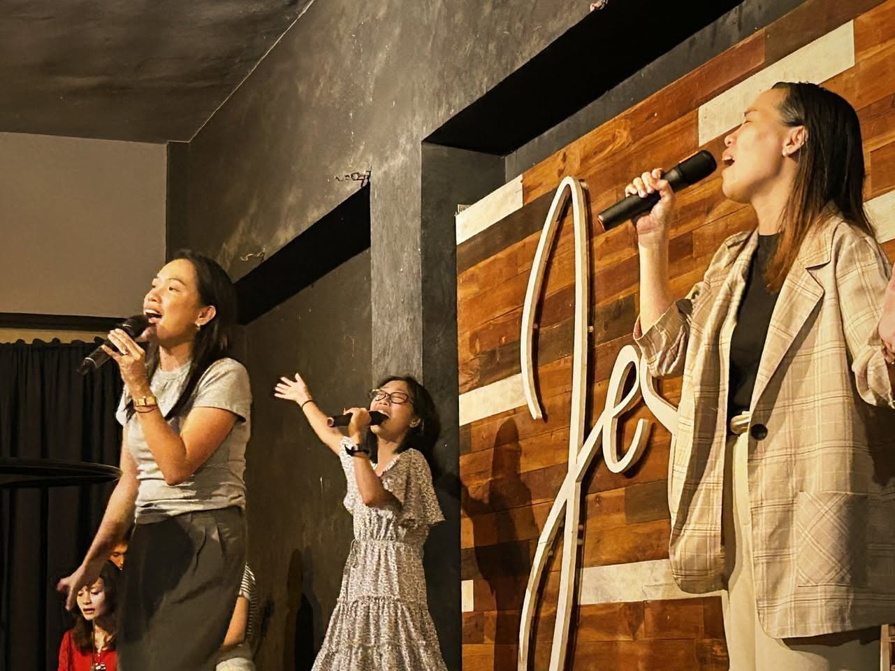 The MCOF worship team leading songs on stage